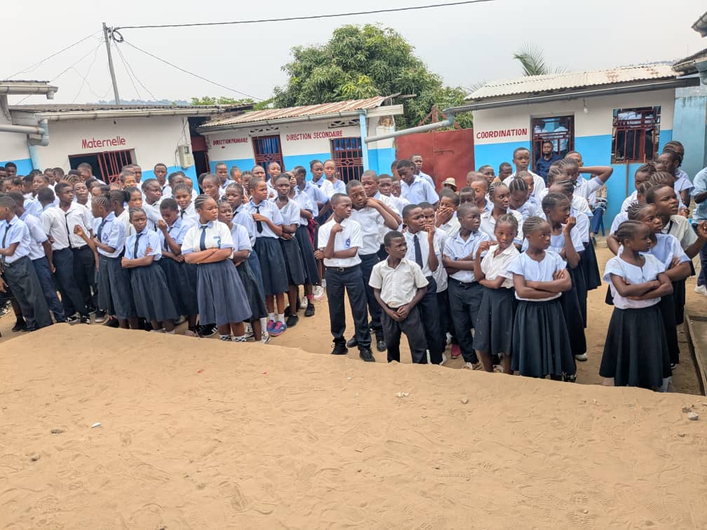Students interacting outside classroom facility structure